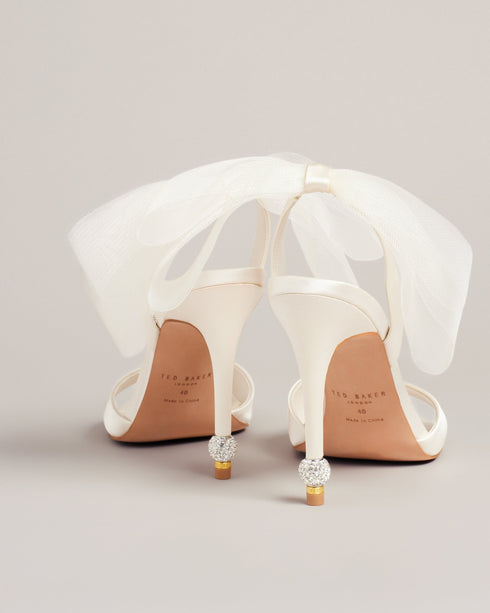 HARINAA-Sandals-Pay attention to the details with HARINAA. These satin sandals are crowned wth a double mesh organza bow at the back and crystal embellishment on the stiletto heels for dazzling elegance. Heeled sandals Oversized mesh ankle bow Satin finish Open toe Slim toe strap Crystal embellished heel detail Slingback design- Ted Baker Romania